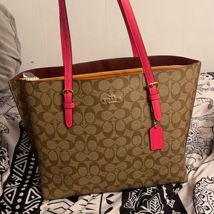 Selling a brand new coach bag with IM/khaki electric pink still has the tag on